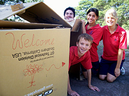 [Photo: students building a shelter]